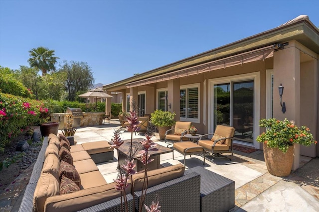 view of patio / terrace featuring outdoor lounge area and an outdoor kitchen