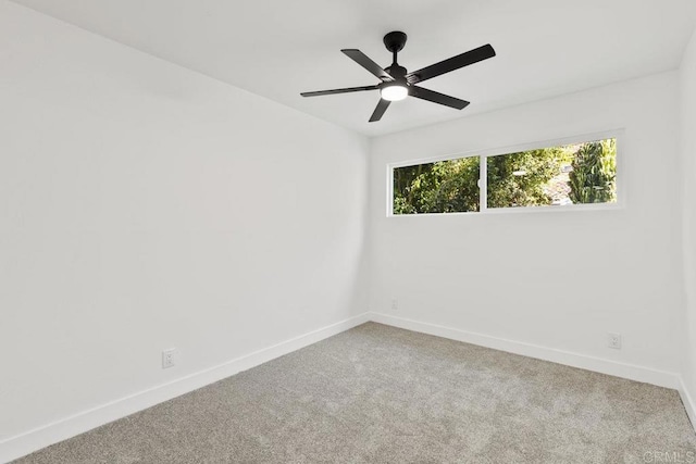 empty room with carpet floors and ceiling fan