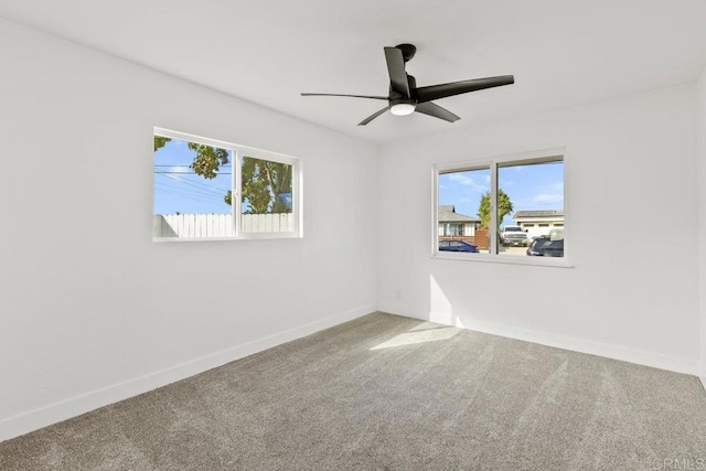 empty room featuring carpet and ceiling fan