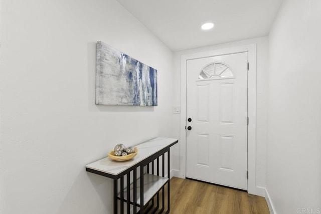 entryway with hardwood / wood-style flooring