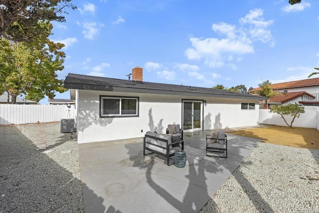 back of house with central air condition unit and a patio area