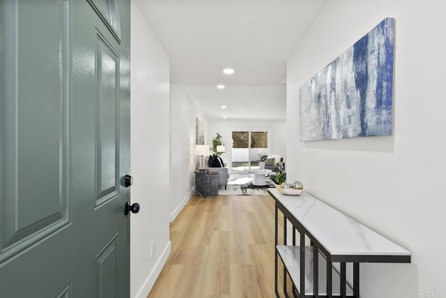 hall with light hardwood / wood-style floors