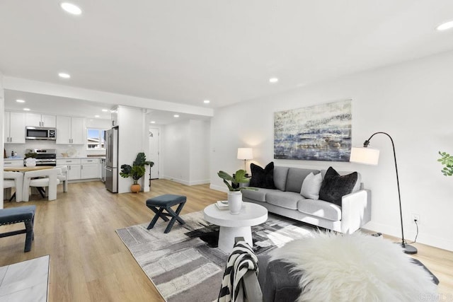 living room with light hardwood / wood-style floors