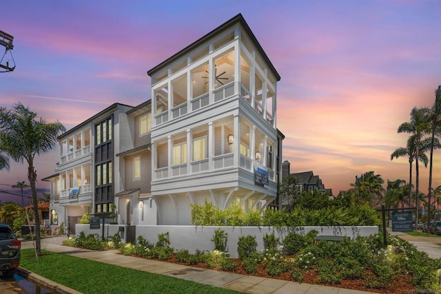 view of front of property featuring a balcony