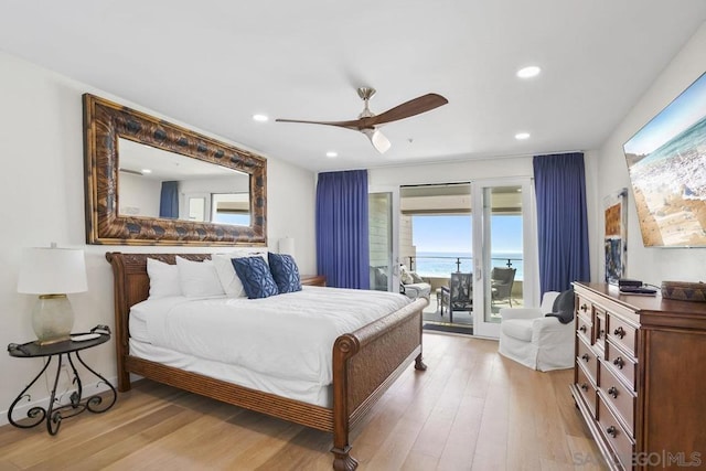 bedroom with ceiling fan, access to exterior, and light hardwood / wood-style floors