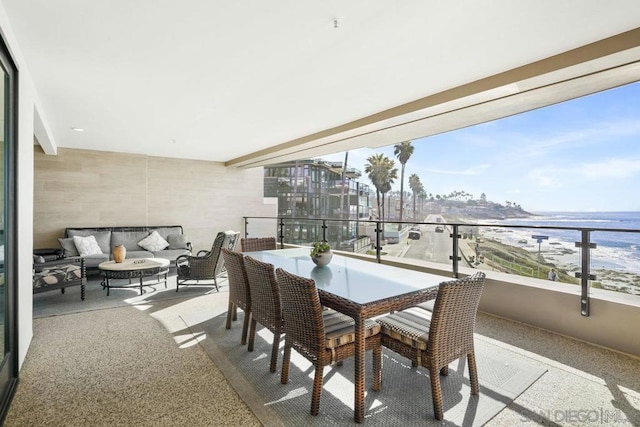 balcony with a water view and outdoor lounge area