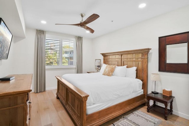 bedroom featuring ceiling fan and light hardwood / wood-style floors