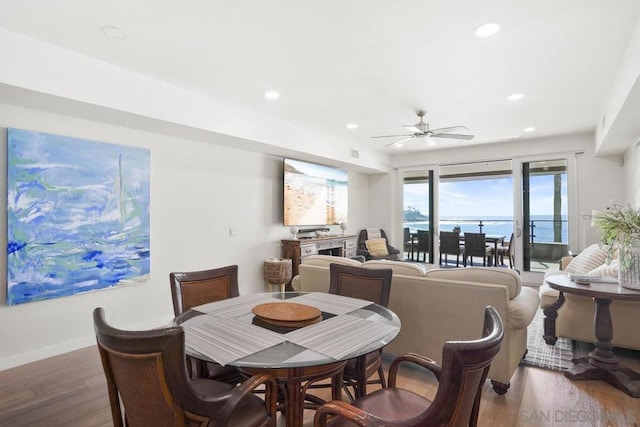 dining area featuring ceiling fan and hardwood / wood-style floors