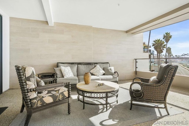 view of patio with a balcony and an outdoor living space