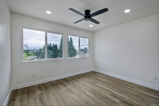 unfurnished room featuring wood-type flooring and ceiling fan