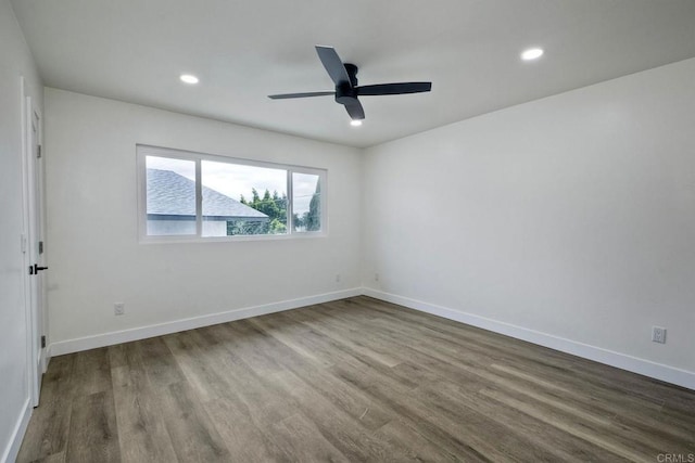 spare room featuring ceiling fan and wood-type flooring