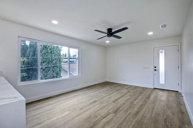 interior space featuring light hardwood / wood-style flooring and ceiling fan