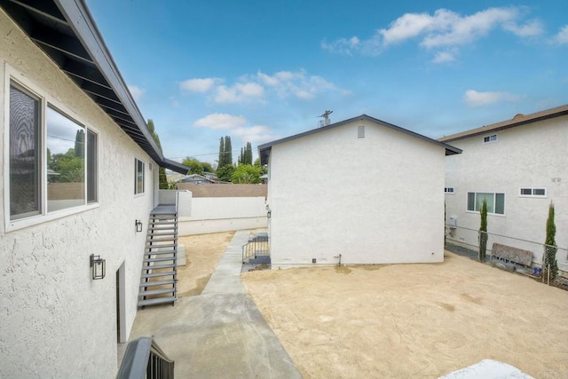 view of side of home featuring a patio area