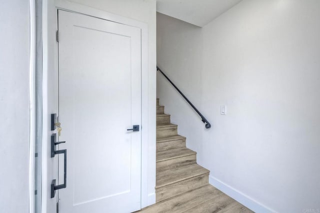 stairway featuring hardwood / wood-style flooring