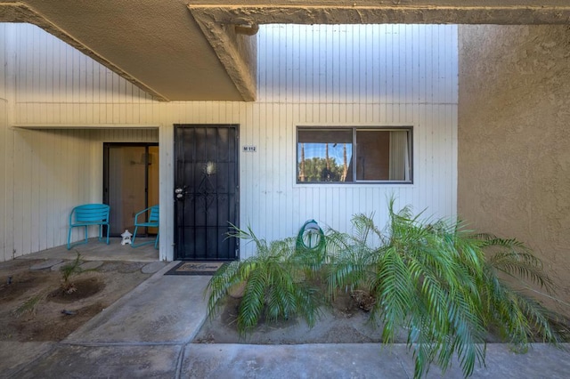 entrance to property with a patio area