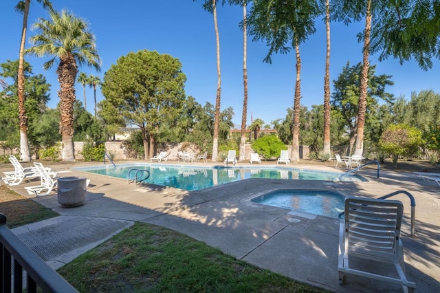 view of pool featuring a patio area and a community hot tub