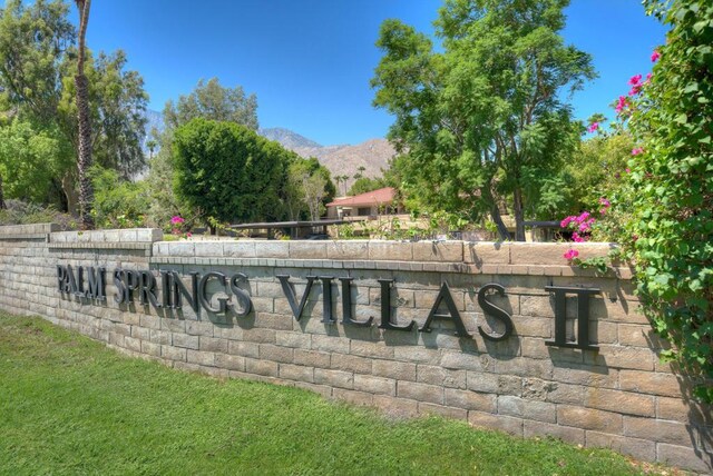 community sign featuring a mountain view