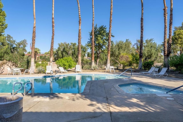 view of swimming pool with a patio area