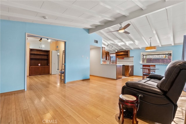 living room with lofted ceiling with beams, light wood-type flooring, and ceiling fan