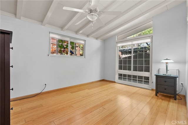 unfurnished room with vaulted ceiling with beams, hardwood / wood-style flooring, and ceiling fan