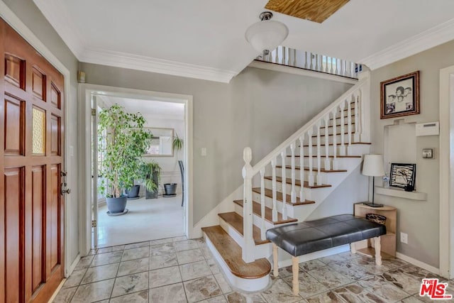 entrance foyer featuring ornamental molding