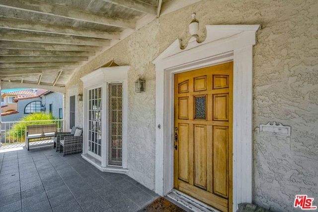 property entrance featuring covered porch