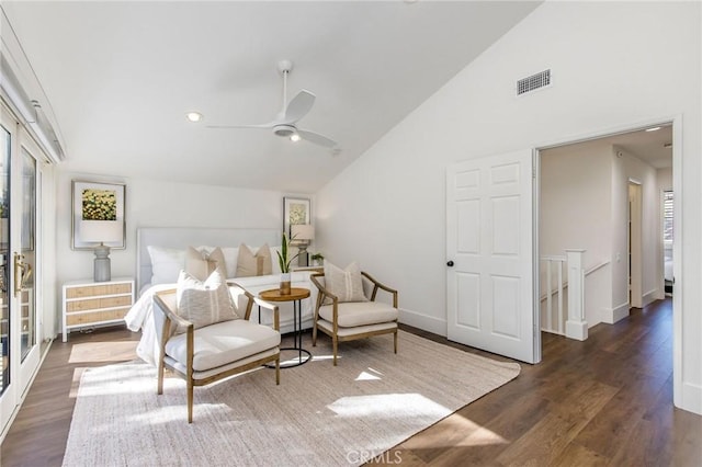 bedroom with ceiling fan, multiple windows, dark hardwood / wood-style floors, and vaulted ceiling