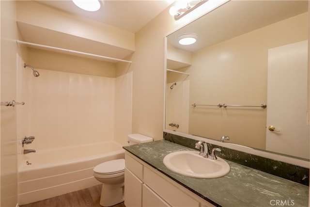 full bathroom with vanity, toilet, hardwood / wood-style flooring, and  shower combination