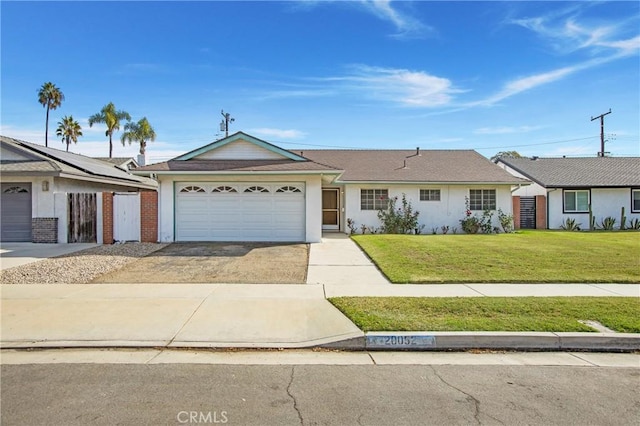 single story home with a front yard and a garage