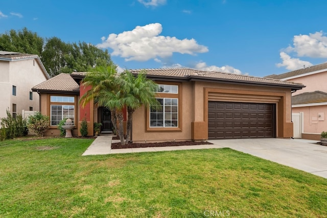 view of front of house featuring a front yard and a garage