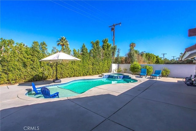 view of pool featuring an in ground hot tub and a patio