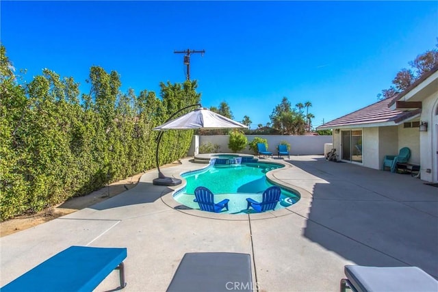 view of swimming pool featuring an in ground hot tub and a patio area