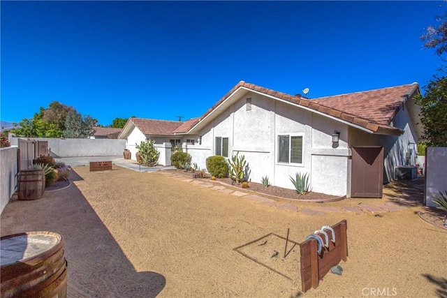 rear view of house with a patio