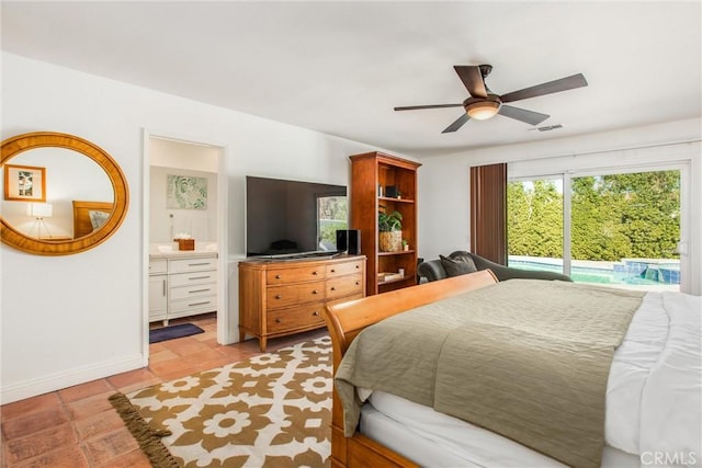 tiled bedroom featuring access to outside, ensuite bath, and ceiling fan