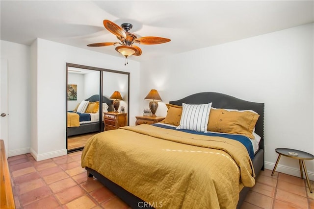 tiled bedroom with a closet and ceiling fan