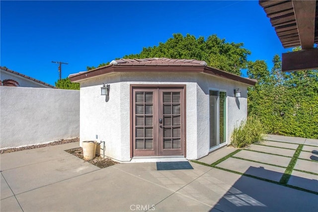 view of outbuilding featuring french doors