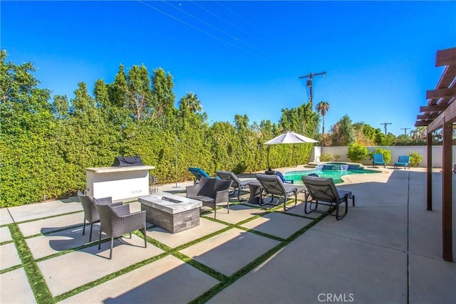 view of patio featuring an outdoor fire pit, area for grilling, and a pool with hot tub