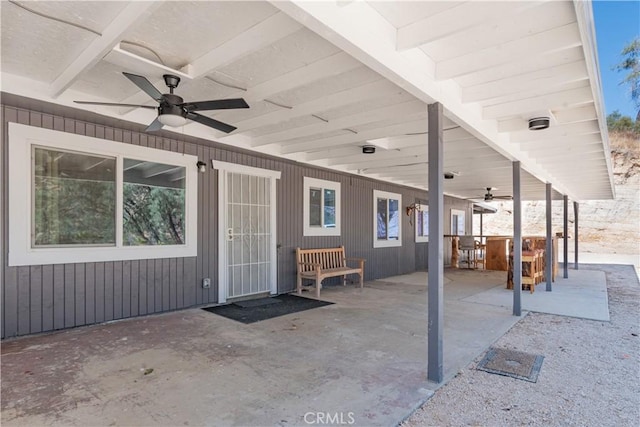 view of patio featuring a hot tub and ceiling fan