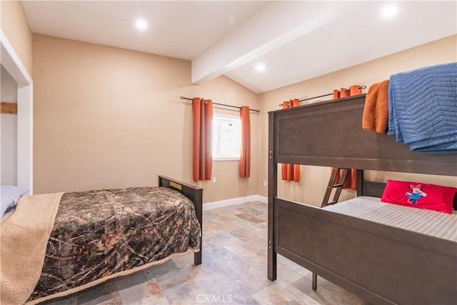 bedroom featuring lofted ceiling with beams