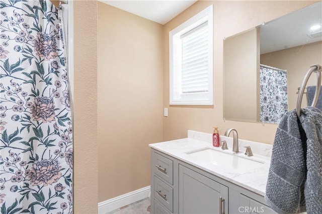 bathroom with vanity and a shower with shower curtain