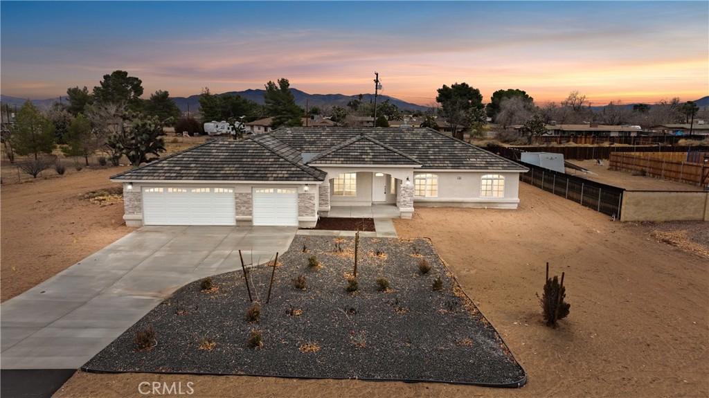 view of front of home featuring a garage and a mountain view