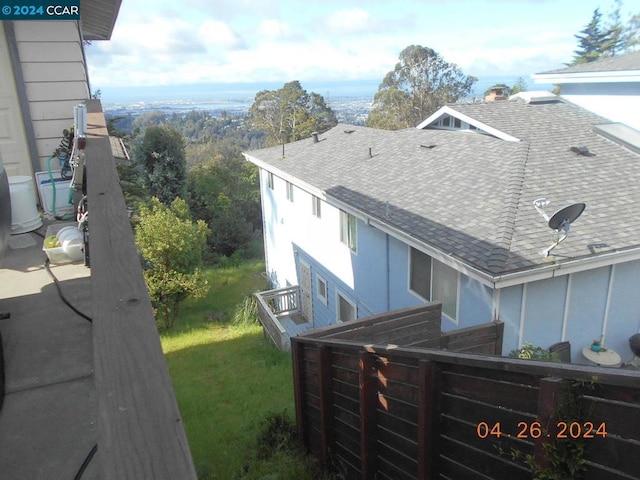 view of side of home with a lawn