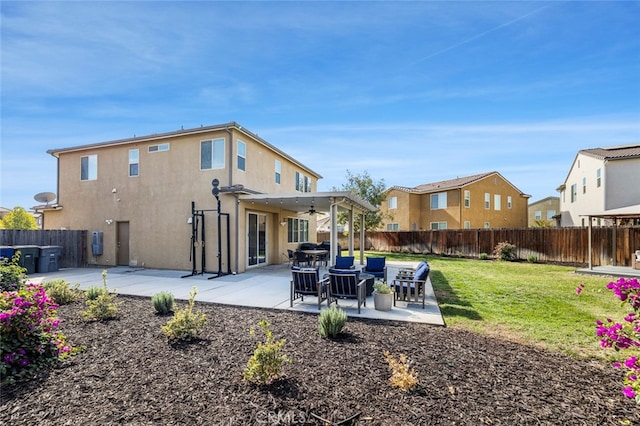 rear view of house featuring a patio, a yard, and a pergola