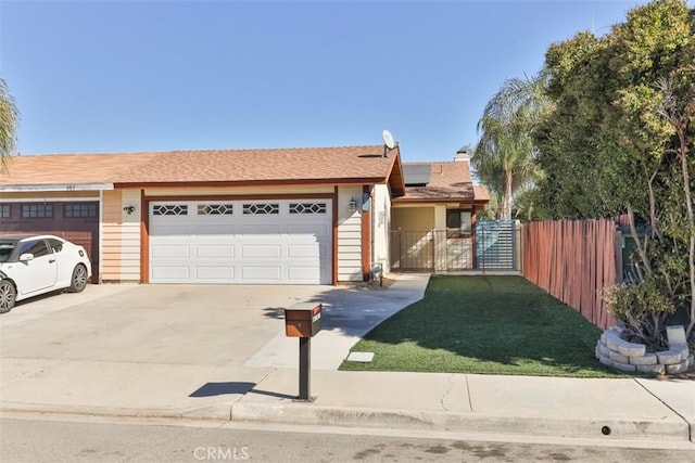 single story home featuring solar panels, a garage, and a front lawn