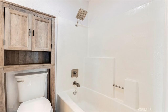 bathroom featuring bathtub / shower combination and toilet