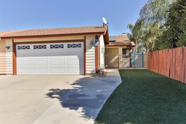 view of front of home featuring a garage and solar panels