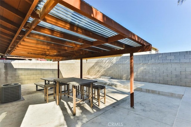 view of patio / terrace with a pergola and central AC unit