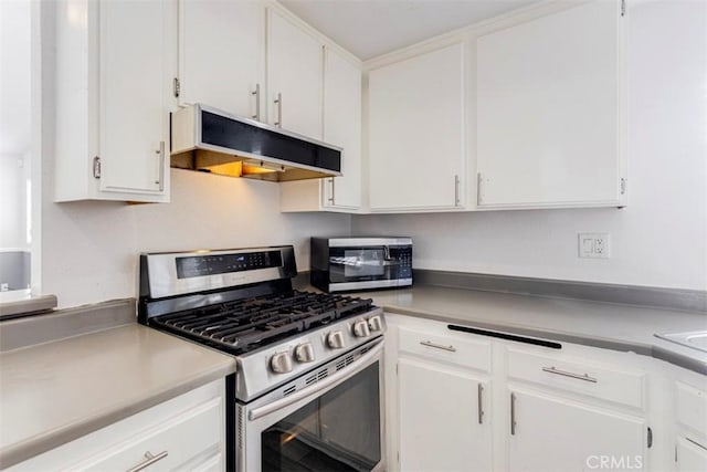 kitchen featuring appliances with stainless steel finishes and white cabinetry