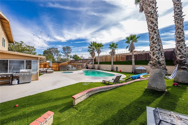 view of pool featuring a patio and a grill