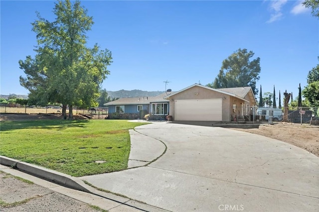 single story home with a front yard and a garage